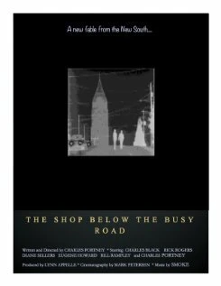 Постер The Shop Below the Busy Road