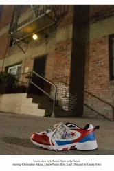 A Tennis Shoe in the Street постер